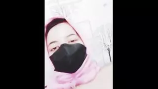hijab woman playing with dildo in room