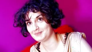 A horny German dark haired babe gets smashed by two cocks