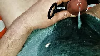 Pissed on and cummed on. Pumped the juices out of the cock with the dilator.