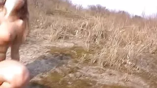 Two hot German babes pleasing a hard cock dude outdoors