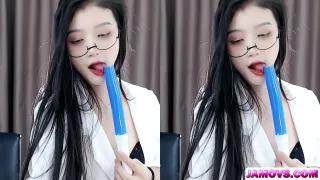 A blowjob is administered from behind and thrust into the crotch of a young woman with lovely genitalia.