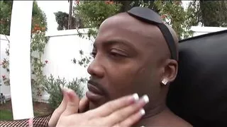 Slutty blonde in leather takes a huge black dick in her ass then gets a hot facial