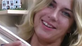 A sexy blonde babe from Germany playing with her glass dong