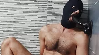 Masked daddy moaning and sucking dildo