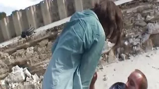 Good looking German brunette pleasing two loaded cocks outdoors