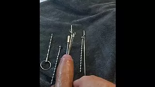 Extreme urethral sounding + cum. Hard oiled cock stuffed full. Multiple objects and sounds in cock.