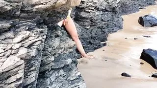 stepdad walks on the beach and meets naked stepdaughter masturbating peeps and comes up with a cock.