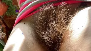 Smoking two cigarettes outside closeup big hairy bush