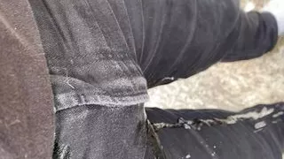 Pissing my black jeans outside