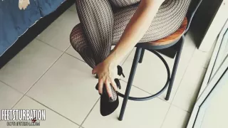 Shoe Dangling With Fishnets And Black High Heels