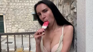 Girl With Big Tits Passionately Licks Ice Cream In A Street Cafe (popsicle)