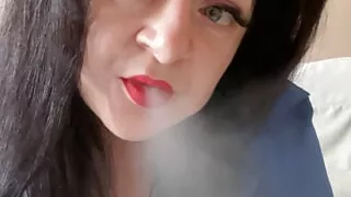 Hot Mistress Lara sexually smokes in camera and shows her big boobs