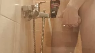 The guy washes in the shower, dreaming of sharing this place with someone else