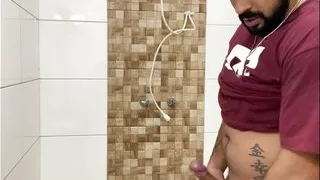 Squirting cum, bearded in a cap alone in the bathroom having fun in the handjob until cumming a lot - Rodrik Dick