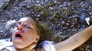 The MILF is a slut with huge breasts and a shaved vagina enjoying a cock inside her pussy on the beach