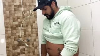 Bearded in the bathroom playing with his Big Cock until he cums and spreads sperm