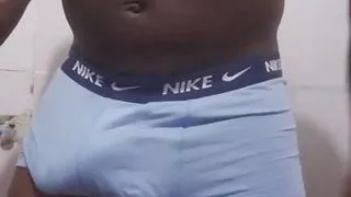 Muscled black Nigerian guy jerks off in the bathroom.