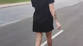 A slim trans girl shows her little ass in public.