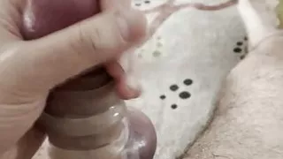 Jerking his dick with silicone