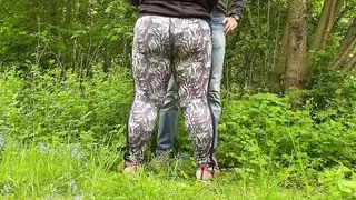 Son-in-law's hands are busy with mother-in-law's sexy ass while she jerks off his cock in nature