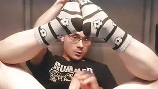 Nerdy college boy in cute socks with footballs jerking off instead of doing homework