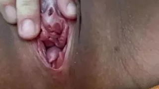 Close up of playing with big lip and big clit pussy