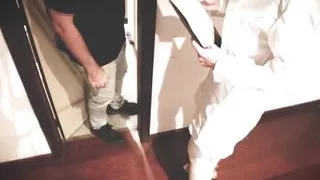 A nurse helps a patient ejaculate in a sperm bank.