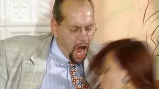 A curvy redhead slut from Germany taking two loaded cocks at the same time