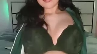 Busty teen in a tiny bikini gets naughty on camera