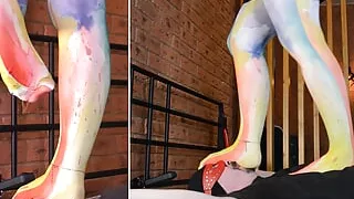 Mistress in opaque pantyhose trampling and standing on slave face