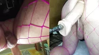 Dual View Crossdresser in shiny skirt and fishnet gets his anal pussy fucked by fucking machine, cock leaks
