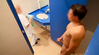 I surprise the cleaning lady at the gym giving me a handjob in the bathroom and she helps me finish cumming with a blowjob
