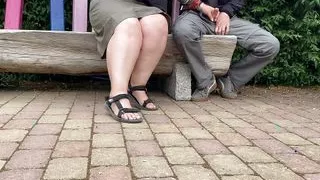 Mother-in-law jerks son-in-law's cock in a public park