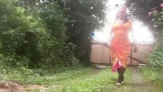 In orange dress outdoors