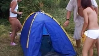 An amazing brunette babe pleasing a loaded cock in the woods