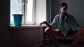 Sexy mom washes windows and play in foam