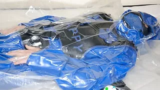 Jul 9 2023 - VacPacked in slvrbrboy's coveralls with my blue pup gear and jade harnesses