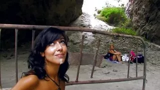 Lone camper woman watches as a young couple fucks in a cave
