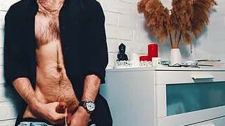 The handsome man jerks off on camera and cums loudly, splashing the floor with his sperm. 4K