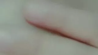 Curvy horny girl sucks her own nipples while masturbating