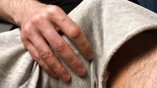 Noel Dero caresses his cock through his shorts and fills his hands with warm sperm from pleasure.