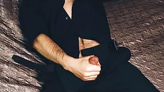 Young handsome man Noel Dero masturbates on the bed in a beautiful suit and brings himself to orgasm.