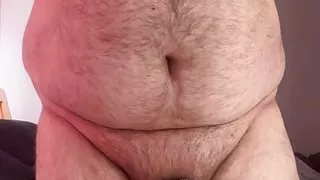 Ball bound with cock in chastity cage and butt plug insertion