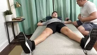 Chubby dom Matt tickles and jerks off restrained stud Dimitri