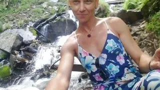 Alexa Cosmic swimming in beautiful waterfall wearing colorful combi dress...