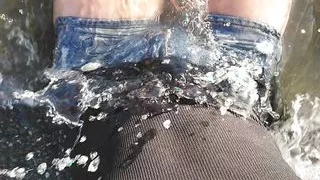 On public beach I sit on the shore wearing shorts and t-shirt and wetting my feet in the sea ...