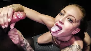 inked blonde babe shows off her blowjob  skills at the gloryhole