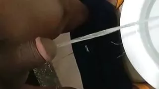 Indian daddy pissing in the bathroom