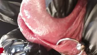 This is Close Up Extreme. Second side view. Latex gloves, detailled peehole and cumshot.