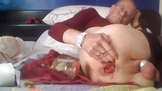 Inserting a thick jam jar into my open ass cunt 2